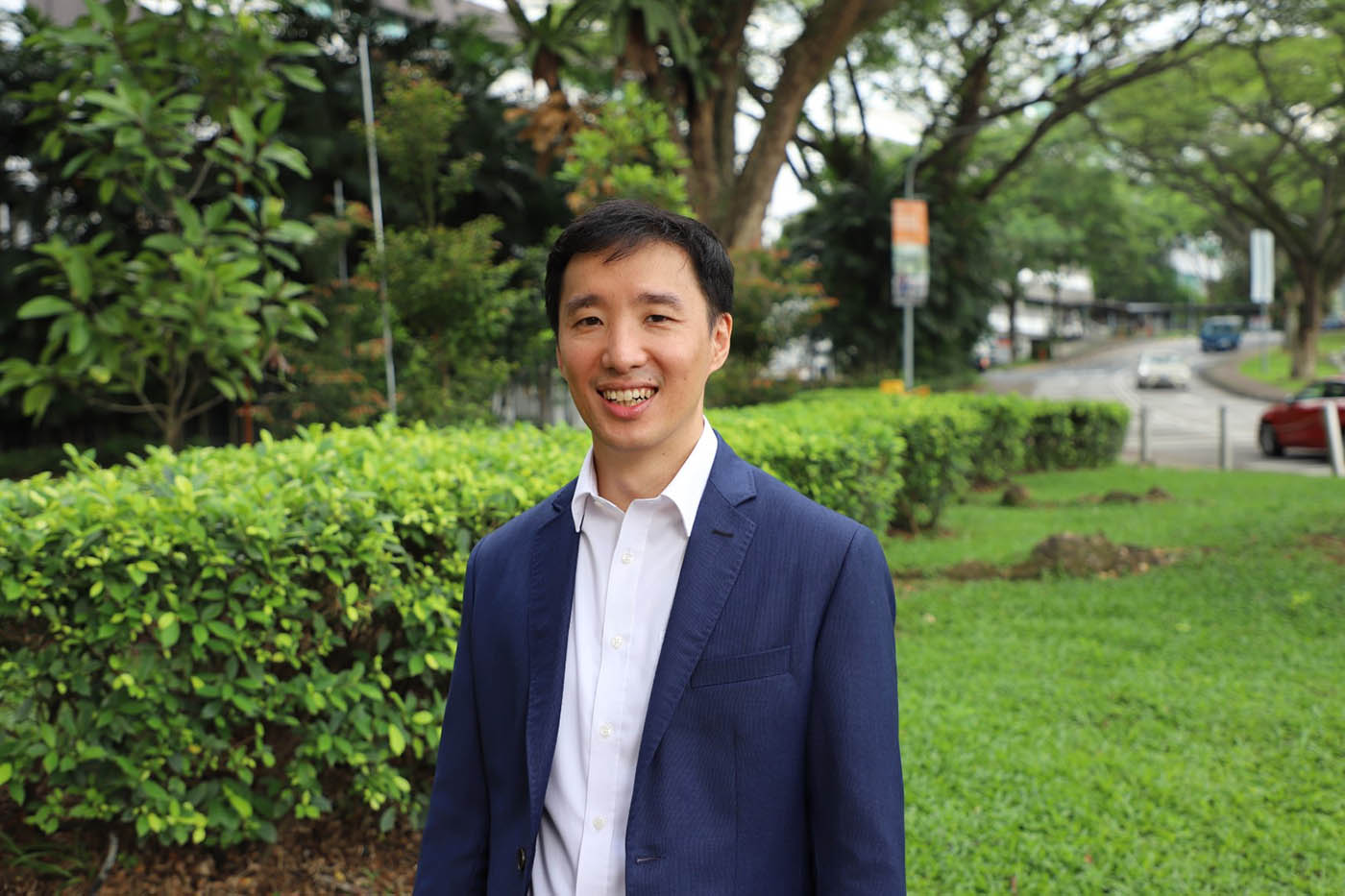 Quantum physicist Alexander Ling at the National University of Singapore pictured standing in a green corner of the university campus